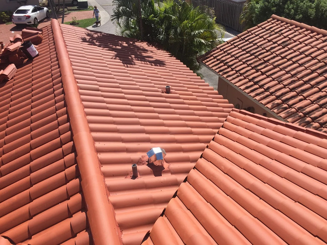 a red Spanish tile roofing system
